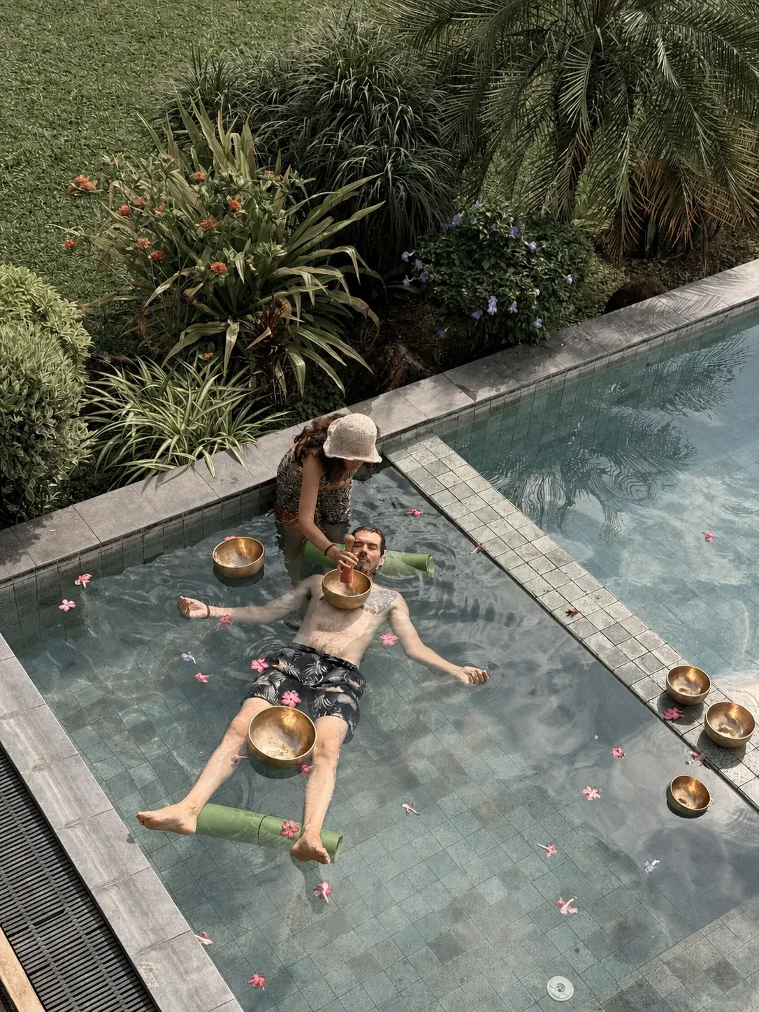A floating sound-bath experience in the shallow pool
