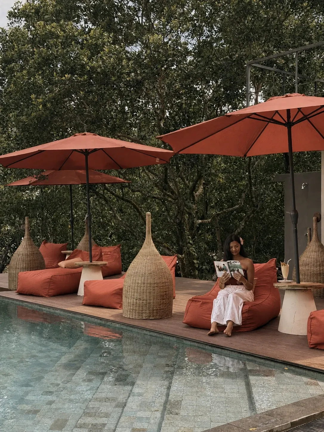A guest reading quietly beside the pool